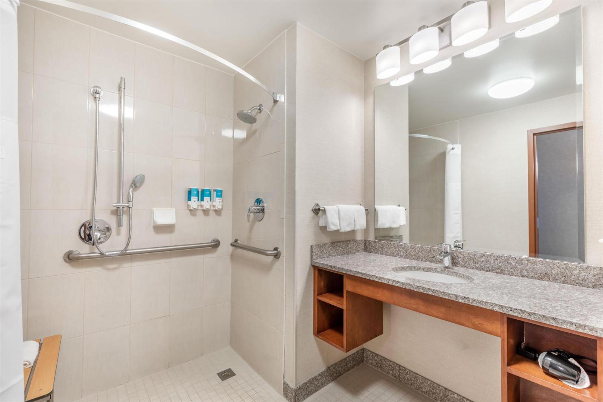 Deluxe Queen Room Two Queen Beds Hearing Accessible Roll Shower