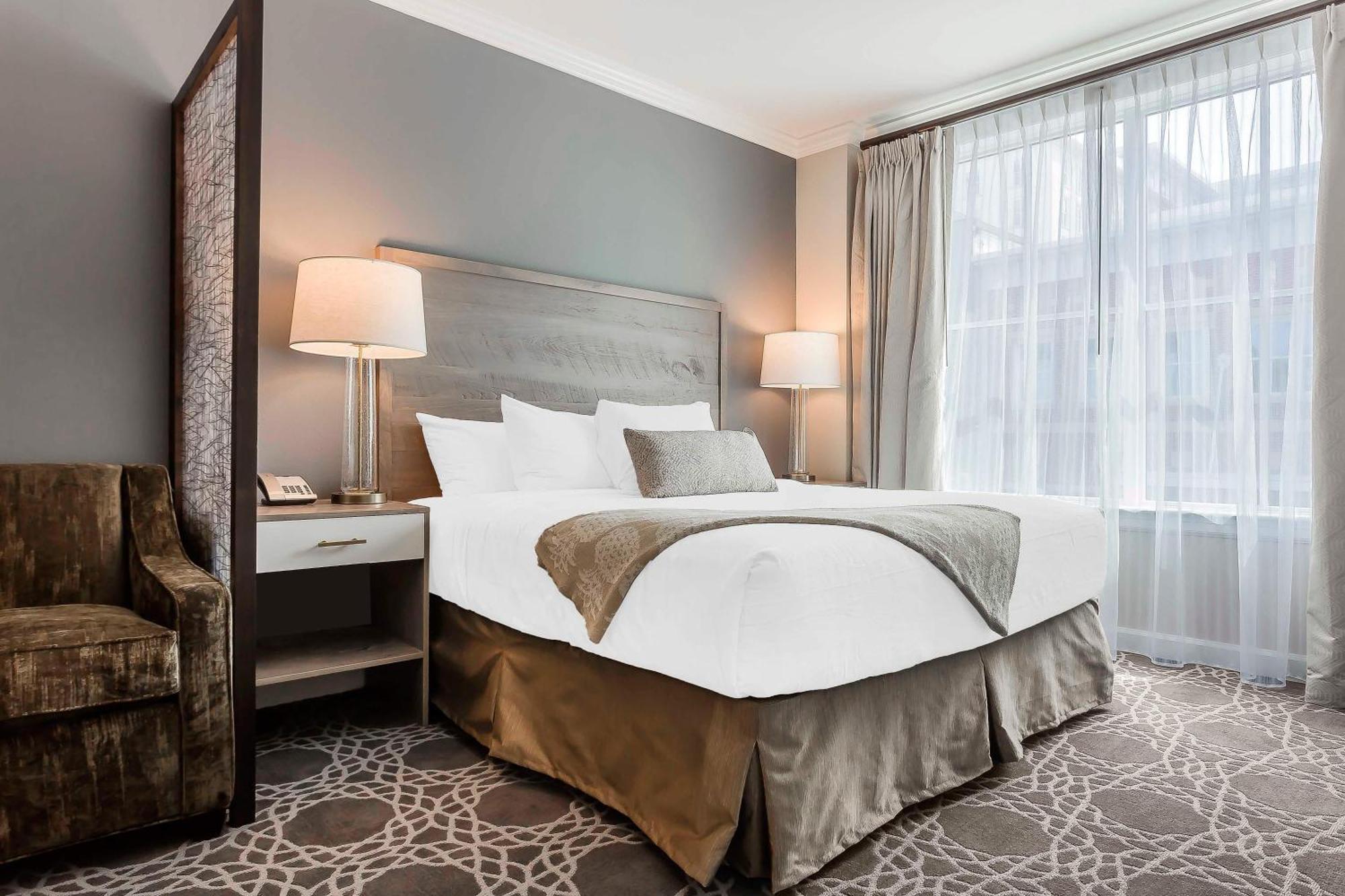 Two-Bedroom Suite with One King, Two Queen Beds, and Sofa Bed