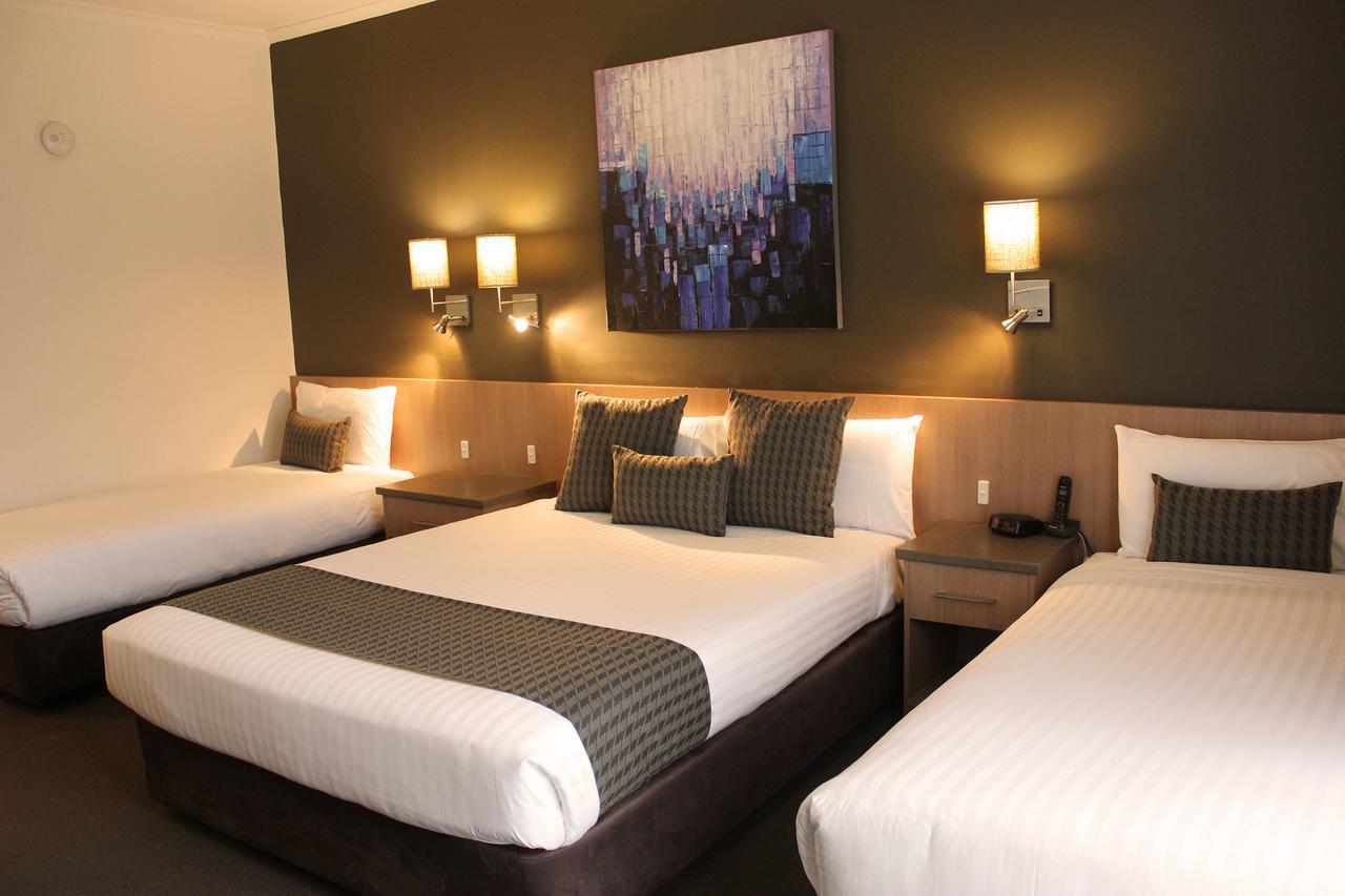 Deluxe Queen Room with One Queen and Two Single Beds
