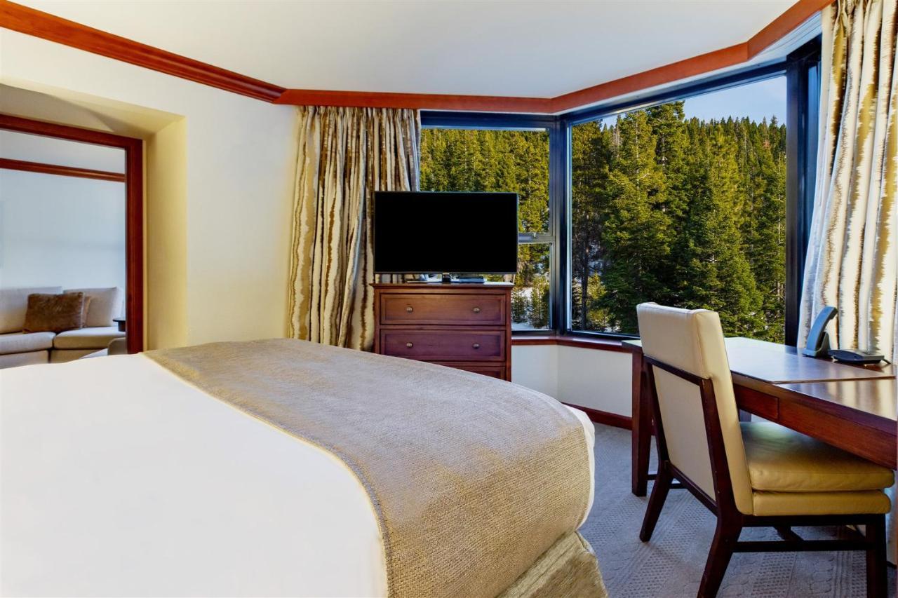 Suite with Fireplace and Forest View